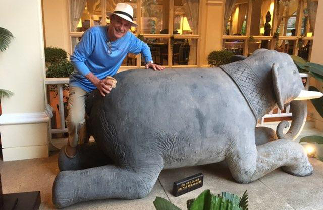 Jim scrubbing an elephant hiney