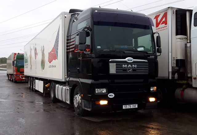 a truck shipping cars